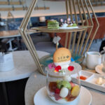 Cookie on candy glass over matcha, milk and berries